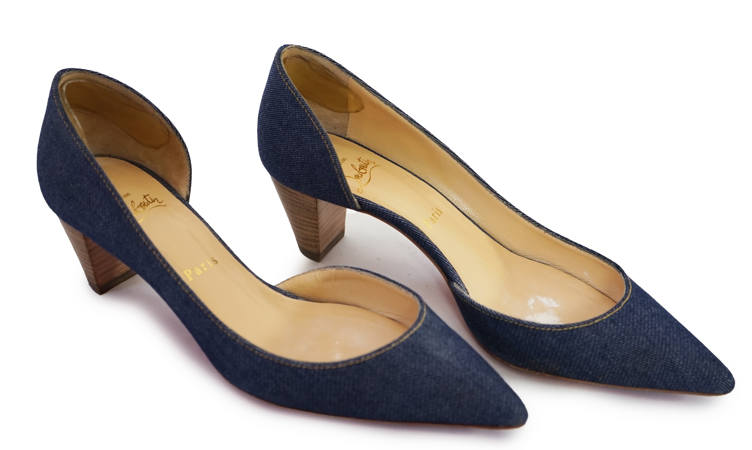 A pair of Christian Louboutin lady's denim pumps with wooden heels, comes with dust bag in original box. Size 39. Proceeds to Happy Paws Puppy Rescue